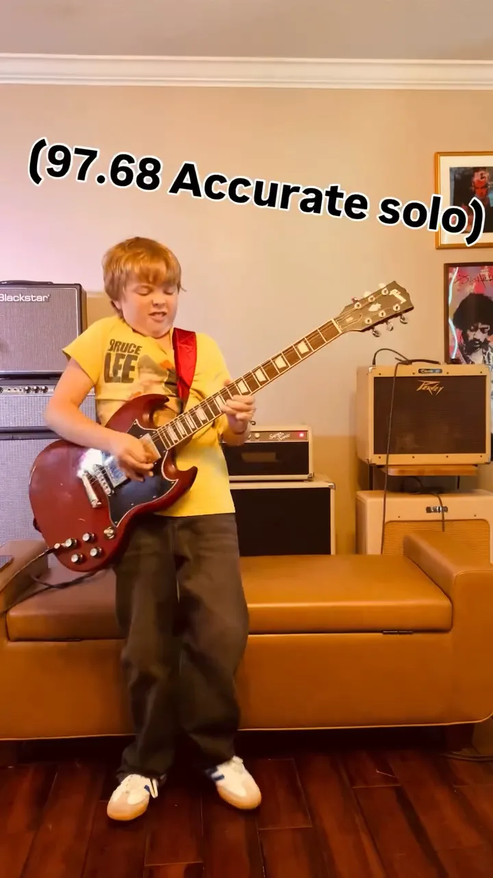 Emmitt DeWater playing a red Gibson SG for a Bohemian Rhapsody solo