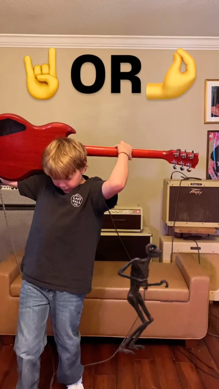 Emmitt DeWater playing a red Gibson SG for Johnny B. Goode