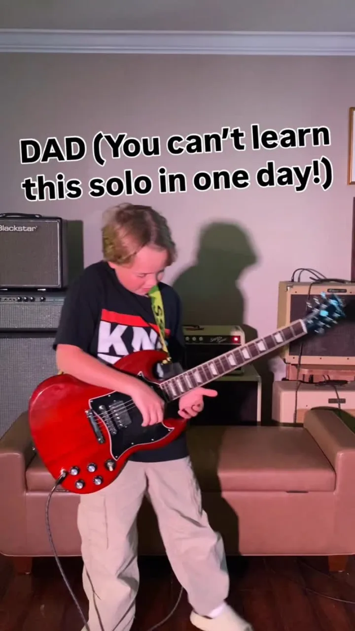 Emmitt DeWater playing a red Gibson SG for a Journey solo