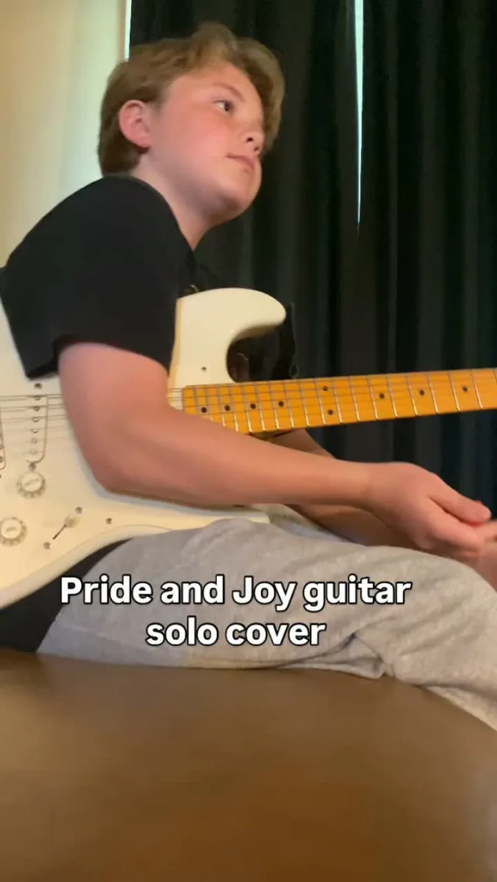 Emmitt DeWater playing a white Stratocaster for a Pride and Joy solo