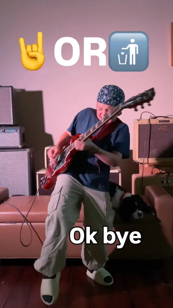 Emmitt DeWater playing a red Gibson SG