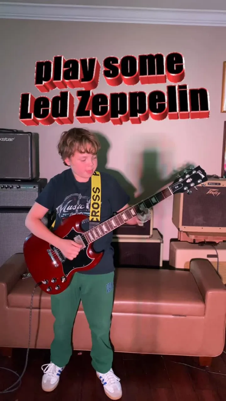 Emmitt DeWater playing a red Gibson SG beneath the words Play some Led Zeppelin