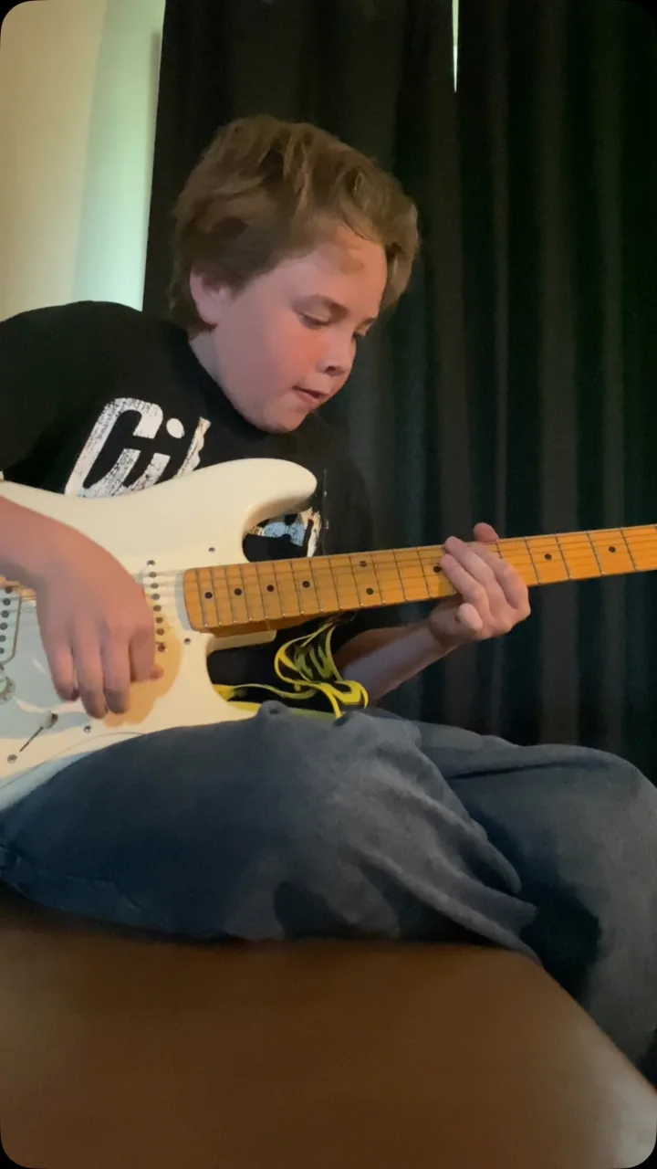 Emmitt DeWater playing a white Stratocaster